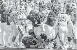  ?? Tim Warner ?? Rice’s Sam Glaesmann (4) threw for 187 yards and a score while adding 89 yards and two touchdowns on the ground in the 42-28 loss to Louisiana Tech.