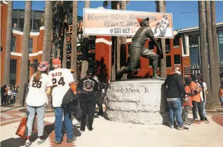  ??  ?? The Willie Mays statue outside Oracle Park wore a birthday hat Friday.