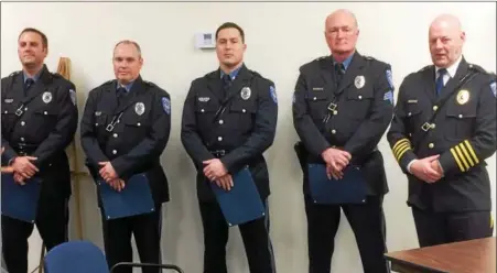  ?? EVAN BRANDT — DIGITAL FIRST MEDIA ?? New Hanover Police Officers Michael Salvo, Dennis Psota, Detective Dekkar Dyas, along with Sgt. William Moyer and Chief Kevin McKeon, at the presentati­on of commendati­ons Feb. 27to the three officers.
