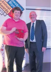  ??  ?? Ben Harries with his award for College Learner of the Year and Paul Croke, Bridgend College Chair of Governors