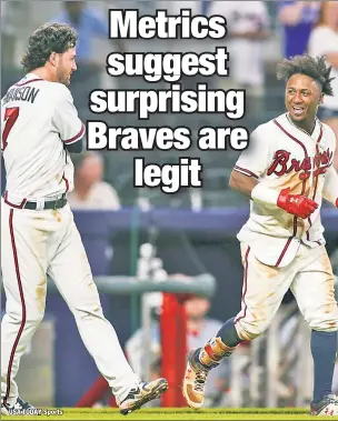  ??  ?? BRAVO: Ozzie Albies (right) celebrates with Braves teammate Dansby Swanson after hitting a walk-off home run against the Reds last week.