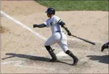  ?? KATHY WILLENS — THE ASSOCIATED PRESS ?? Yankees pinch hitter Thairo Estrada hits a three-run double during the sixth inning of Sunday’s game against the Rays at Yankee Stadium.