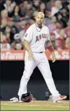  ?? Gina Ferazzi
Los Angeles Times ?? ALBERT PUJOLS tosses his helmet and batting gloves after striking out in the fourth inning against the Royals.