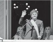  ?? XINHUA Sipa USA ?? Argentina’s new President Javier Milei waves to the crowd from the balcony of the Casa Rosada Presidenti­al Palace in Buenos Aires, Argentina, Dec. 10, 2023.