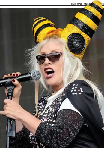  ??  ?? Oh, beehive! On stage with striped headgear in London’s Hyde Park yesterday