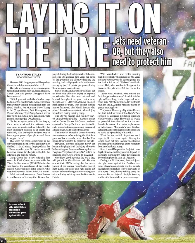  ?? AP ?? Jets quarterbac­k Mike White takes pounding in late-season game against Bills.