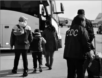  ?? Krysten I. Houk/U.S. Depa rtment of Health and Human Services via AP ?? This Feb. 5 file photo provided by the U.S. Department of Health and Human Services shows evacuees from China arriving at Marine Corps Air Station in Miramar, Calif.