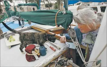  ?? Photog raphs by Robert Gauthier ?? WENDY STONE says that day by day, more live-aboards under threat of eviction are leaving Pete’s Harbor. Plans are to build more than 400 condos and apartments at the marina and reserve its slips for new residents.