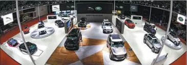  ?? PHOTOS PROVIDED TO CHINA DAILY ?? The Jaguar Land Rover booth at the 2021 Shanghai auto show showcases its latest models.