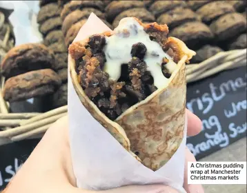  ??  ?? A Christmas pudding wrap at Manchester Christmas markets