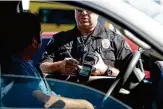  ?? Jeff Gritchen/Getty Images 2014 ?? Racial disparitie­s in the number of California­ns stopped by police were virtually unchanged among the state’s biggest agencies from 2020 to 2021, data shows.