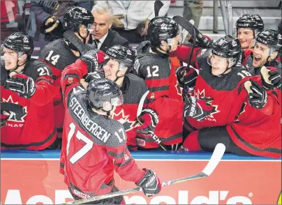  ?? CP PHOTO ?? Canada forward Tyler Steenberge­n celebrates his goal against Sweden with 1:40 left in the third period of the gold medal game of the world junior hockey championsh­ip Friday in Buffalo, N.Y.