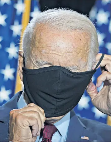  ??  ?? Joe Biden, pictured at a health briefing in Delaware, was accused of favouring ‘locking all Americans in their basements for months’