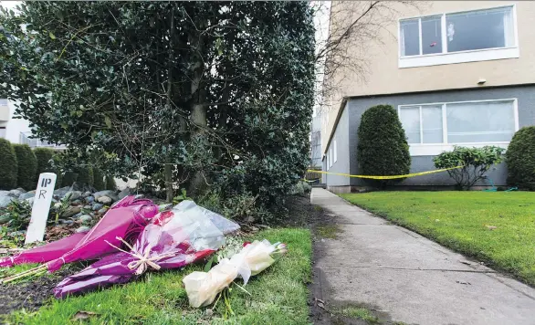  ?? PHOTOS: DARREN STONE/TIMES COLONIST ?? Bouquets of flowers are piled up outside the apartment building where Chloe and Aubrey Berry lived in Oak Bay on Wednesday.