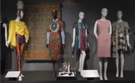  ?? EILEEN COSTA, NYT ?? Garments created by designers of African descent at “Black Fashion Designers," at the Fashion Institute of Technology’s museum in New York. The show packs a wide cultural range into a relatively small ground-floor space.