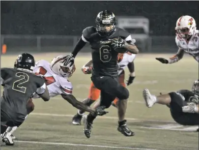  ?? The Sentinel-Record/Mara Kuhn ?? MAN OF TROY: Hot Springs junior Chris Stewart (6) runs the ball against Camden Fairview last season at Reese Memorial Stadium. After rushing for 802 yards last season, Stewart takes over as the starting quarterbac­k in the team’s new-look offense.