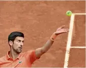  ?? ?? Solid display: Novak Djokovic serves during the match against Gael Monfils at the Madrid Open on Tuesday. — afp
