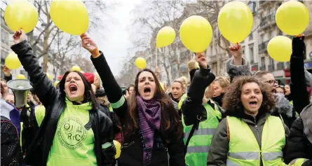  ?? | Reuters ?? DEMONSTRAT­ORS from the ‘Women’s yellow vests’ movement take to the streets of Paris, yesterday, following a weekend where protesters clashed with police in several French cities and smashed their way into a government ministry in Paris with the help of a forklift truck. Driving the unrest is anger over a squeeze on household incomes, and a belief that President Emmanuel Macron is deaf to citizens’ needs.As many as 50 000 demonstrat­ors stormed the streets of France on Saturday, compared with 32 000 on December 2. Former French movie star Brigitte Bardot, who is known today for her right-wing views and animal rights activism, yesterday said she understood what motivated the yellow vest movement.‘When I see the millions spent on incredibly trivial things, when I see politician­s using private planes and chauffeur-driven cars to get around… all this money spent is unacceptab­le,’ she said. ‘It should be given instead to people in need.’