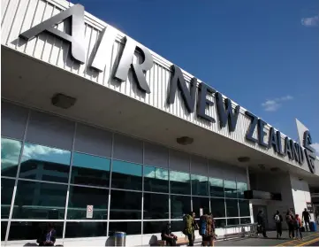  ?? — Reuters photo ?? An Air New Zealand sign is seen at Auckland Airport in New Zealand.