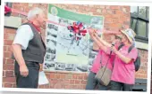  ?? PHOTOS: COLIN WAREING, COLIN AND CAROLE’S CREATIONS ?? Margaret Gardner and Cindy Robertson cut the ribbon to unveil the plaque recording the working boat families of Burscough on the Leeds & Liverpool Canal. The plaque was produced by the Burscough Heritage Group in 2016 to help celebrate the completion of the canal in 1816, while Margaret and Cindy had just completed walking the entire 127¼ miles of the towpath to celebrate a significan­t birthday for Margaret. On the left is BHG chairman Tom Spencer.