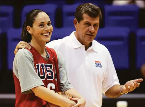  ?? Susan Walsh / Associated Press ?? Geno Auriemma, right, then-head coach of the USA women’s basketball team, stands with Sue Bird during training camp in 2009 at American University in Washington.