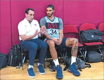  ?? TIM REYNOLDS/AP PHOTO ?? Former USA Basketball coach Mike Krzyzewski talks with Boston Celtics forward Jayson Tatum after the U.S. training camp practice Wednesday in Las Vegas. Tatum played for Krzyzewski at Duke. Krzyzewski is in Las Vegas for a couple days to show support to new USA coach Gregg Popovich and his staff as they prepare for the FIBA World Cup in China.