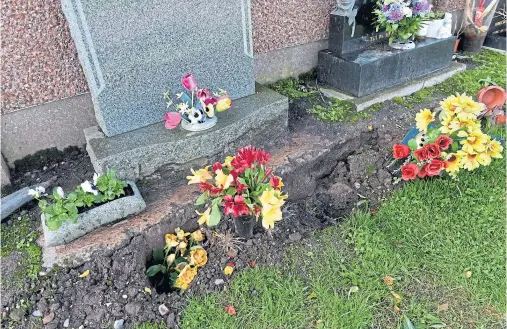  ?? Photograph by Kenny Elrick ?? SHOCK: Wilma Haggart visited her son’s at Grange Cemetery, Peterhead, to find it is sinking.