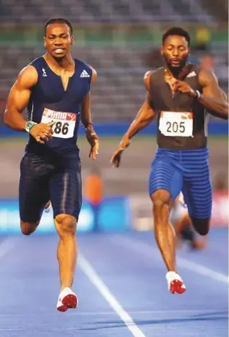  ?? Reuters ?? Jamaica’s Yohan Blake (left) powers to a victory in the men’s 200m final of the JAAA National Senior Championsh­ips at the National Stadium Kingston in Jamaica.
