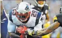  ?? DON WRIGHT/ THE ASSOCIATED PRESS ?? Patriots running back LeGarrette Blount scores the first of his two touchdowns, a 3-yard run during the second quarter of New England’s 27-16 victory over the Steelers on Sunday at Pittsburgh.