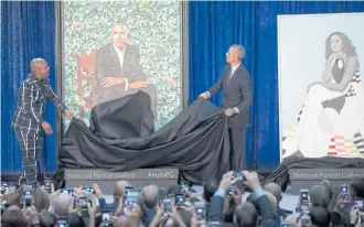  ??  ?? Former US president Barack Obama unveils his portrait alongside the portrait’s artist, Kehinde Wiley, at the Smithsonia­n’s National Portrait Gallery in Washington, DC.