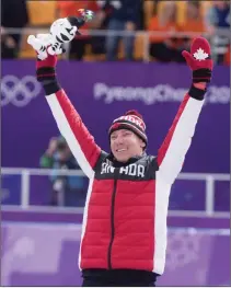  ?? Associated Press photo ?? Men's 10,000-metre speed skating gold medalist, Canada's Ted-Jan Bloemen salutes the crowd from the podium during victory ceremonies at the Pyeonchang Winter Olympics Thursday in Gangneung, South Korea.