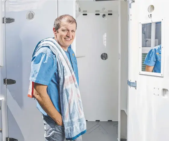  ?? Picture: JERAD WILLIAMS ?? Splashdown Event Services Qld general manager Peter Coryndon checking out some shower units.