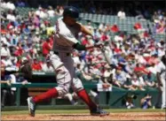  ?? AP PHOTO/JIM COWSERT ?? Boston Red Sox’s Xander Bogaerts connects for an RBI double scoring J.D. Martinez against the Texas Rangers during the third inning of a baseball game, Sunday, May 6, 2018, in Arlington, Texas.