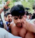  ?? — PTI ?? Sacked Delhi minister Kapil Mishra (left) on indefinite hungerstri­ke at his residence in New Delhi on Wednesday. Police takes away Ankit Bhardwaj (above) after he attacked Mr Mishra.