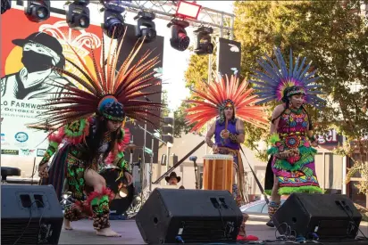  ?? PHOTOS BY GERARDO ZAVALA — DAILY DEMOCRAT ?? Dancers kick off the Yolo County Growers & Farmworker­s Festival Friday in downtown Woodland. The event aimed to connect farmworker­s to vital resources and give them a chance to relax.