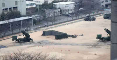  ??  ?? TOKYO: A PAC-3 surface-to-air missile launcher, used to engage incoming ballistic missile threats, is seen in position on the grounds of the defense ministry in Tokyo yesterday. Japan’s Prime Minister Shinzo Abe said three of the four missiles North...