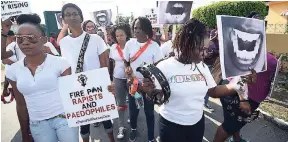  ?? RICARDO MAKYN/MULTIMEDIA PHOTO EDITOR ?? Supporters of the Tambourine Army and allied groups participat­e in the Survivors Empowermen­t March against sexual violence along Molynes Road on March 11. Controvers­y has swirled around the Army since its co-founder Latoya Nugent was arrested on March...