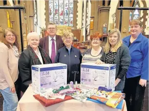  ??  ?? ●●Local councillor­s, crafters and members of St Matthew’s Church with the donated Brother sewing machines and craft items ready for delivery