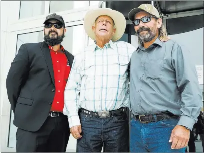  ?? Marcus Villagran ?? Las Vegas Review-journal @brokejourn­alist From left, Eric Parker, Cliven Bundy and Scott Drexler stand in front of the Lloyd George U.S. Courthouse after Drexler’s court hearing Thursday. U.S. District Judge Gloria Navarro decided Parker and Drexler will not face prison time for their roles in the 2014 Bunkervill­e standoff.