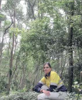  ??  ?? Theresia Ott, the senior ecologist and supervisor of RBM’ s mine rehabilita­tion programme, sits in a rehabilita­ted section of the coastal forest, which is about 37 years old.