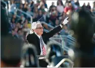  ?? RECORDER PHOTO BY CHIEKO HARA ?? Jim Kusserow directs twelve area school bands Saturday at the annual Veterans Day Frank "Buck" Shaffer Band-a-rama at Rankin Stadium in Portervill­e.