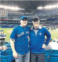  ??  ?? Toronto native and Massachuse­tts-based physician Jordan Glicksman, seen with his father, Harry Glicksman, at Rogers Centre, called on Blue Jays president Mark Shapiro Thursday to advocate for the cancellati­on of cross-border travel for MLB games and the cancellati­on of the season as a whole.