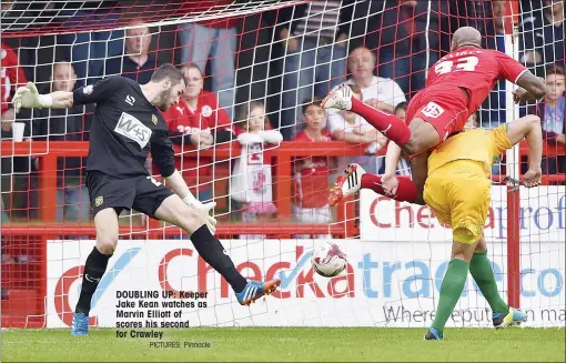  ?? PICTURES: Pinnacle ?? DOUBLING UP: Keeper Jake Kean watches as Marvin Elliott of scores his second for Crawley