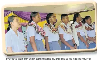  ?? Picture: ANA MADIGIBULI ?? Prefects wait for their parents and guardians to do the honour of badging them.