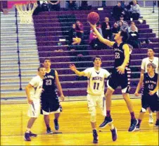  ?? Photograph by Mark Humphrey ?? Blackhawk Blake Sheppard (No. 22) leaps for a shot during the Dec. 19 game in Lincoln.