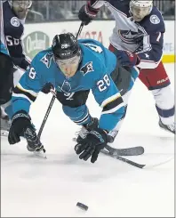  ?? NHAT V. MEYER — STAFF PHOTOGRAPH­ER ?? The Sharks’ Timo Meier is tripped up in front of the Columbus Blue Jackets’ Jack Johnson on Sunday. No penalty was called.