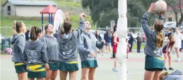  ??  ?? Above: The Marist Sion College team warm up ahead of their match against Red Bend Catholic College.