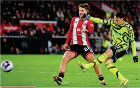  ?? GETTY IMAGES ?? Running riot: Martinelli fires in Arsenal’s third goal in 15 minutes before Havertz (right) evades Robinson’s lunge to make it 4-0