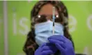  ?? Parnaby/AFP/Getty Images ?? A health worker prepares a coronaviru­s vaccine at a pop-up Covid-19 vaccinatio­n clinic operating at the MyLahore British Asian Kitchen in Bradford, West Yorkshire on 23 December 2021. Photograph: Lindsey