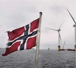  ?? BLOOMBERG PIC ?? An assembly site of offshore floating wind turbines operated by Statoil ASA in Stord, Norway. On climate change reporting, including tracking greenhouse gas emissions, Statoil got a strong ‘A-’.